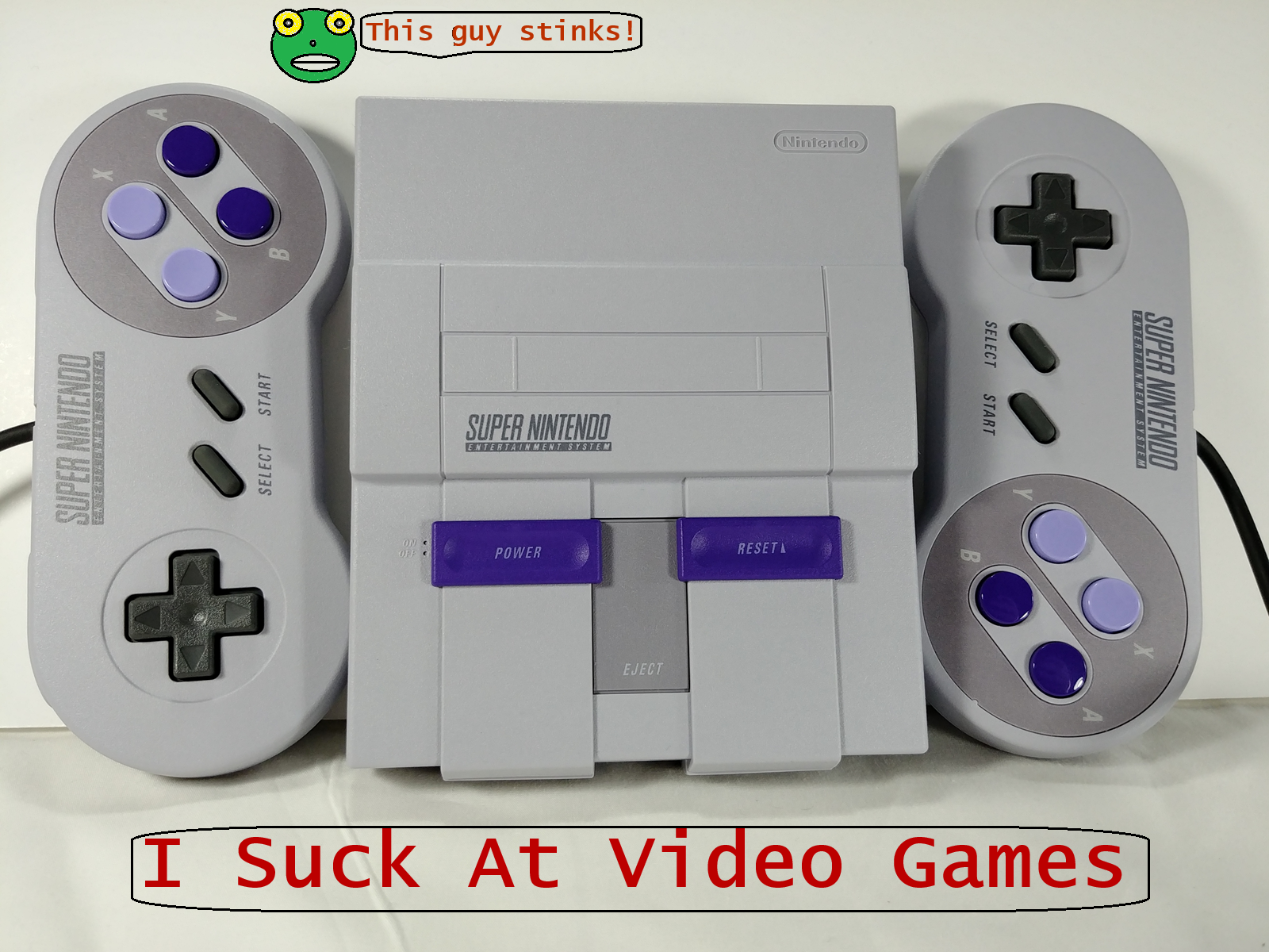 My actual SNES mini, professionally photographed, featuring a cartoon character and the words 'I suck at video games'